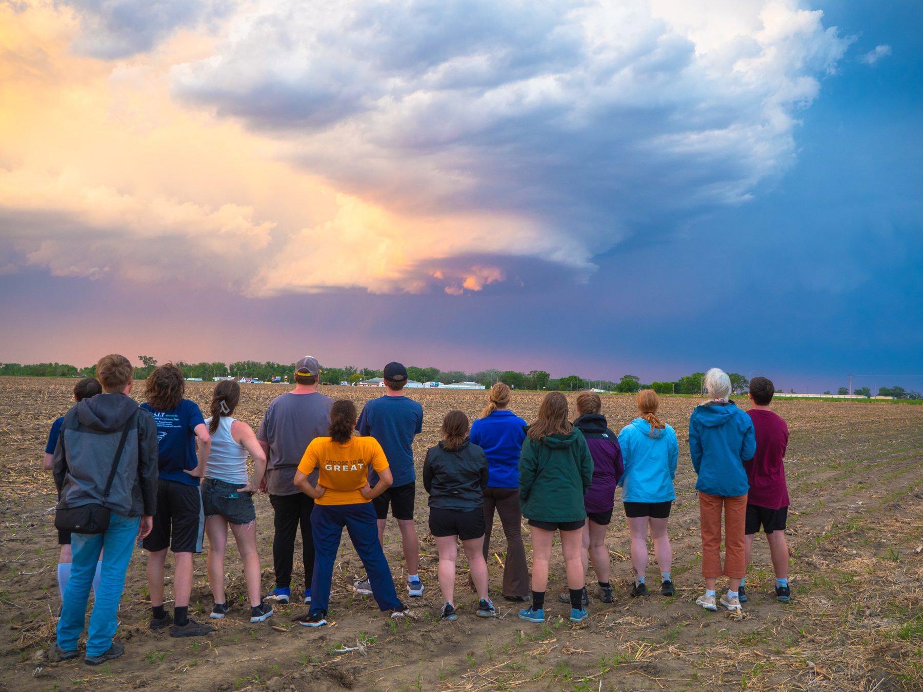 Students and researchers watching a developing storm during a convective field study